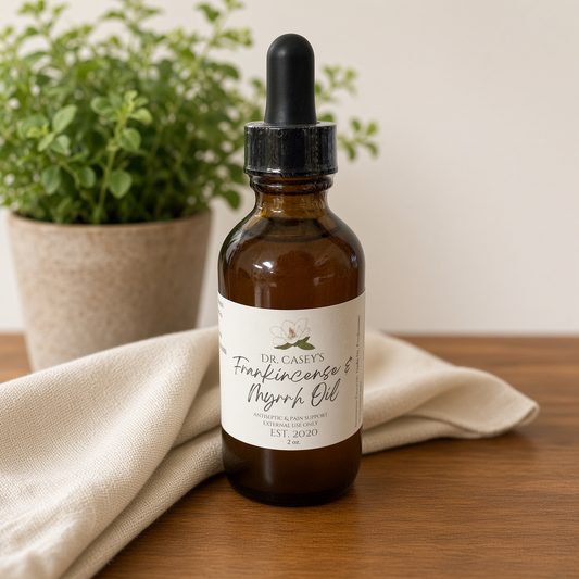 Dr. Casey's Frankincense & Myrrh Oil — plant and cream linen (Casey GO 2026-09-13)